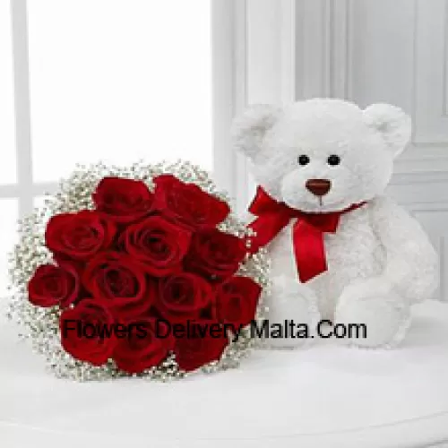 Bouquet de 11 roses rouges avec des remplissages saisonniers accompagné d'un mignon ours en peluche blanc de 14 pouces de hauteur