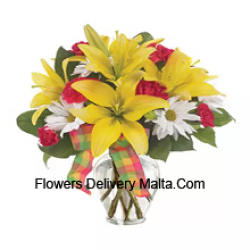 Yellow Lilies, Red Carnations And Suitable Seasonal White Flowers Arranged Beautifully In A Glass Vase
