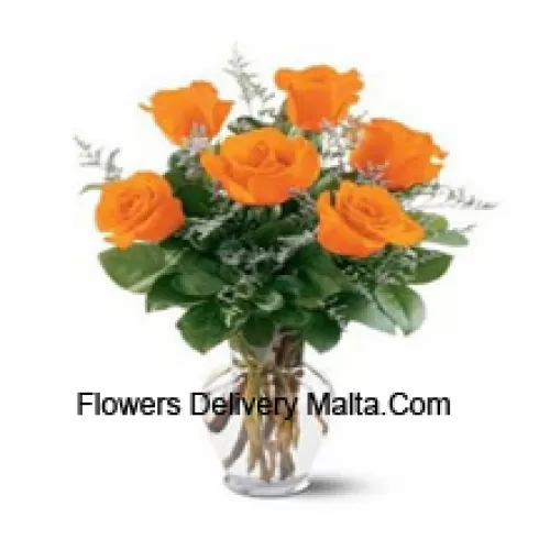7 Yellow Roses With Some Ferns In A Glass Vase