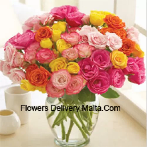 51 Mixed Colored Roses Arranged Beautifully In A Glass Vase