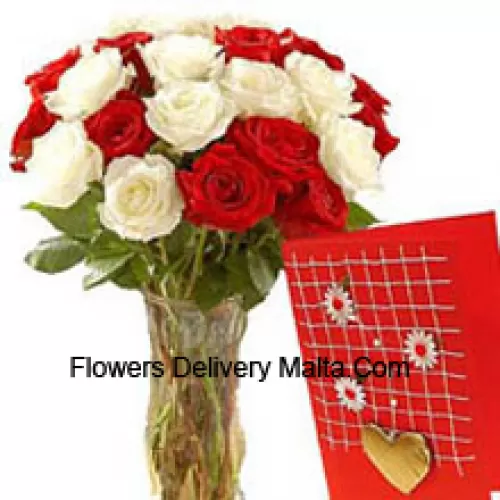 15 Red And 10 White Roses In A Glass Vase Accompanied With A Free Greeting Card