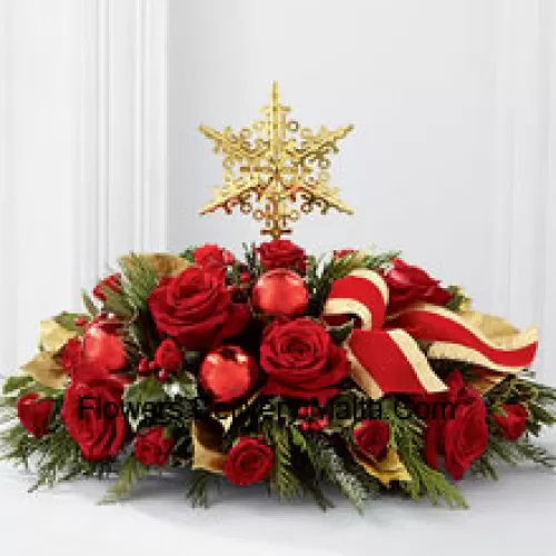 A grand and elegant way to add to the beauty of their holiday festivities. Rich red roses and spray roses are arranged with assorted holiday greens, variegated holly, shiny red holiday balls and a gold-edged red ribbon, all encircling a gold metallic star-shaped tree topper to create a unique and sophisticated holiday centerpiece.  (Please Note That We Reserve The Right To Substitute Any Product With A Suitable Product Of Equal Value In Case Of Non-Availability Of A Certain Product)